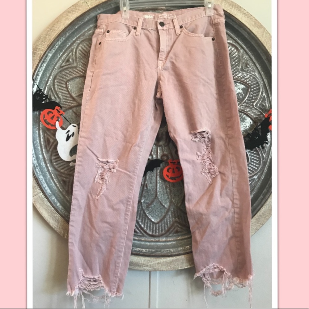 Baby pink distressed jeans